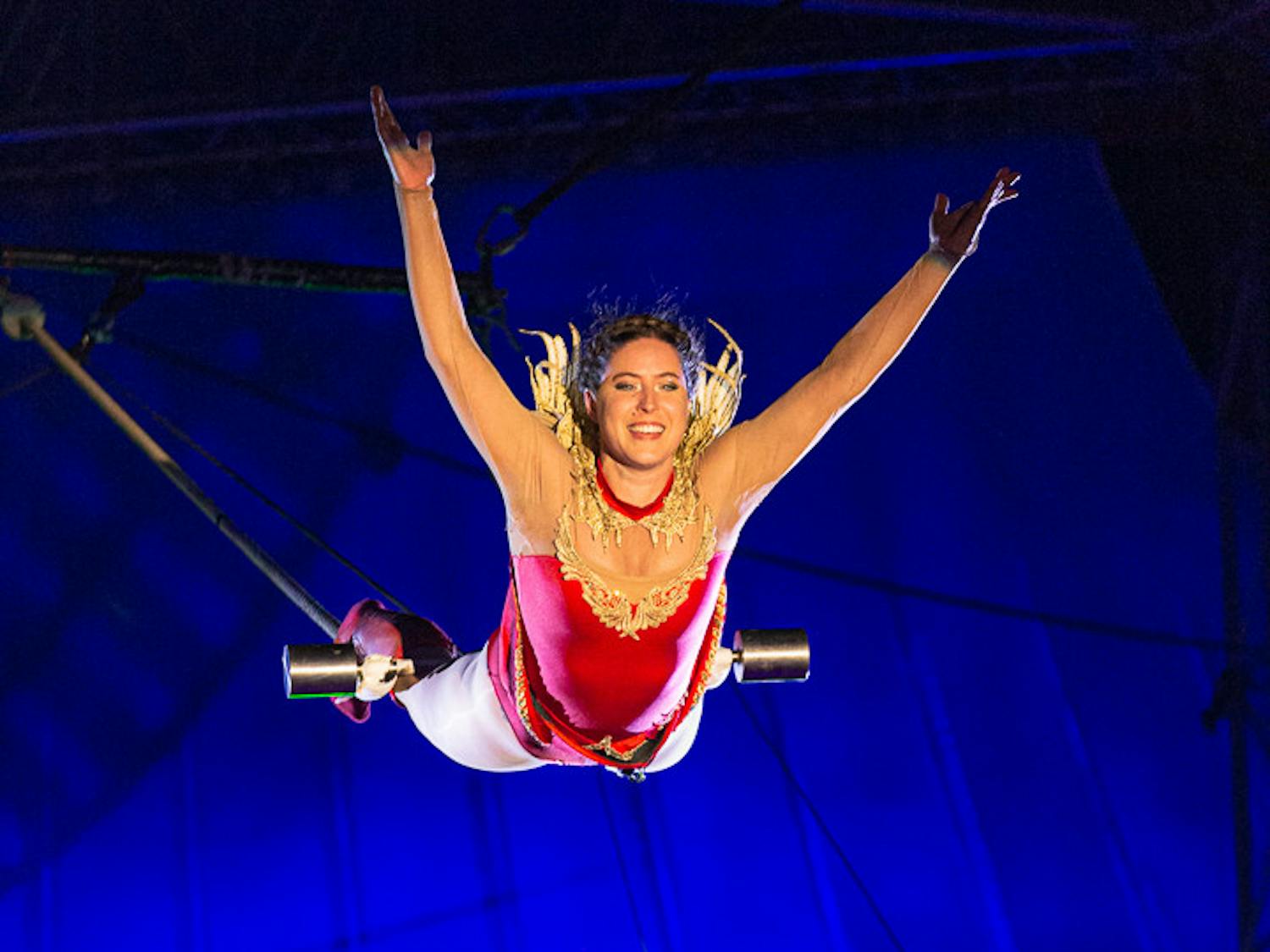 Trapeze artist Disharmony looks out to the crowd as she descends towards the middle of the circus during her act at the South Carolina State Fair circus on Oct. 18, 2022. The circus and state fair took place from Oct. 12-23. 2022.