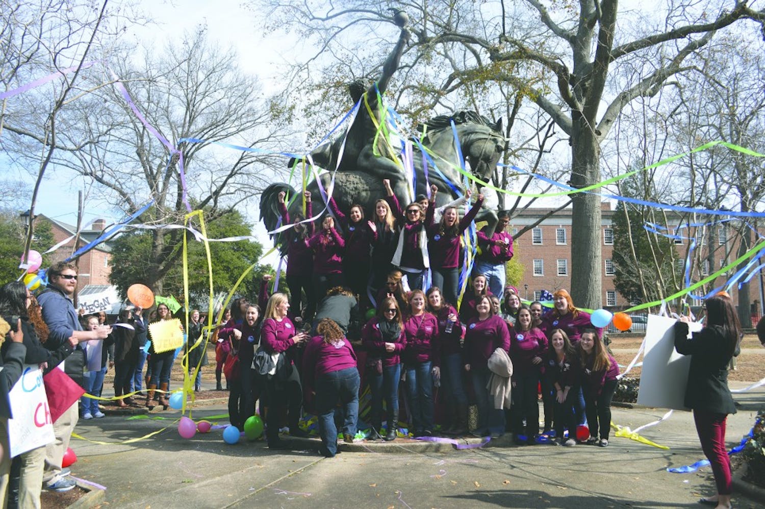 	Higher education and student affairs (HESA) graduate students ran from Wardlaw College to &#8220;The Torchbearer&#8221; statue in celebration after completing their final comprehensive exam Friday afternoon.