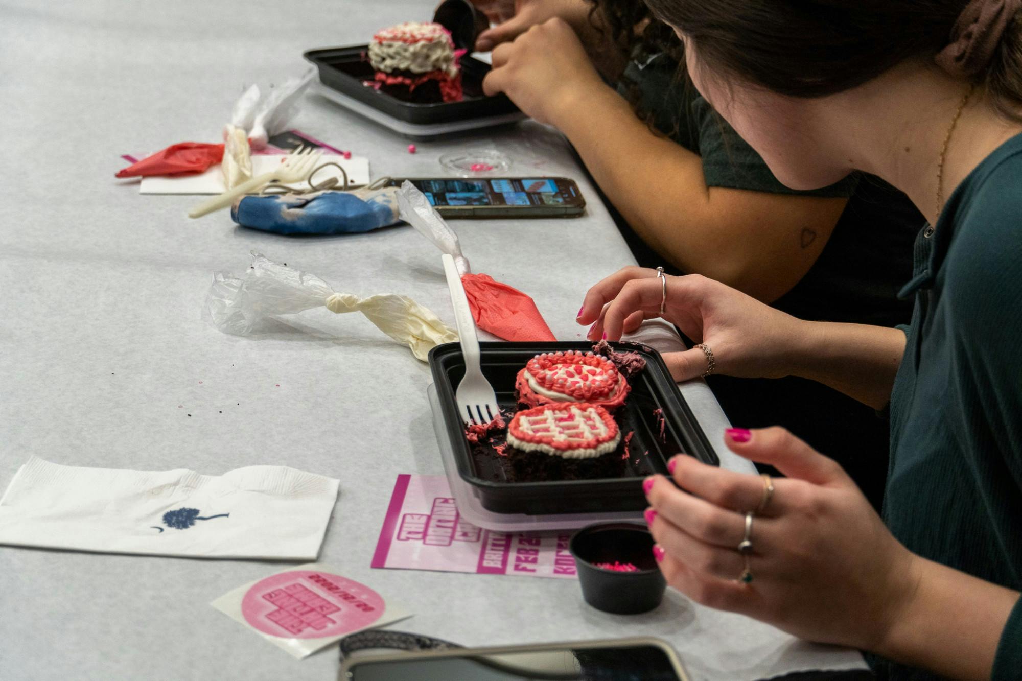 Attendees of the Carolina Production’s Cake Decorating event decorate cupcakes on Feb. 16, 2022. Carolina Production’s team hosts a variety of culture and community events including concerts, karaoke, arts and crafts and movie nights.