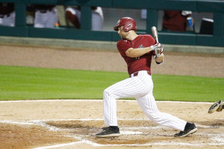 Senior right fielder Andrew Eyster swings at a pitch during Tuesday's game against UNC. The Gamecocks fell to the Tar Heels 3-2 in 10 innings.