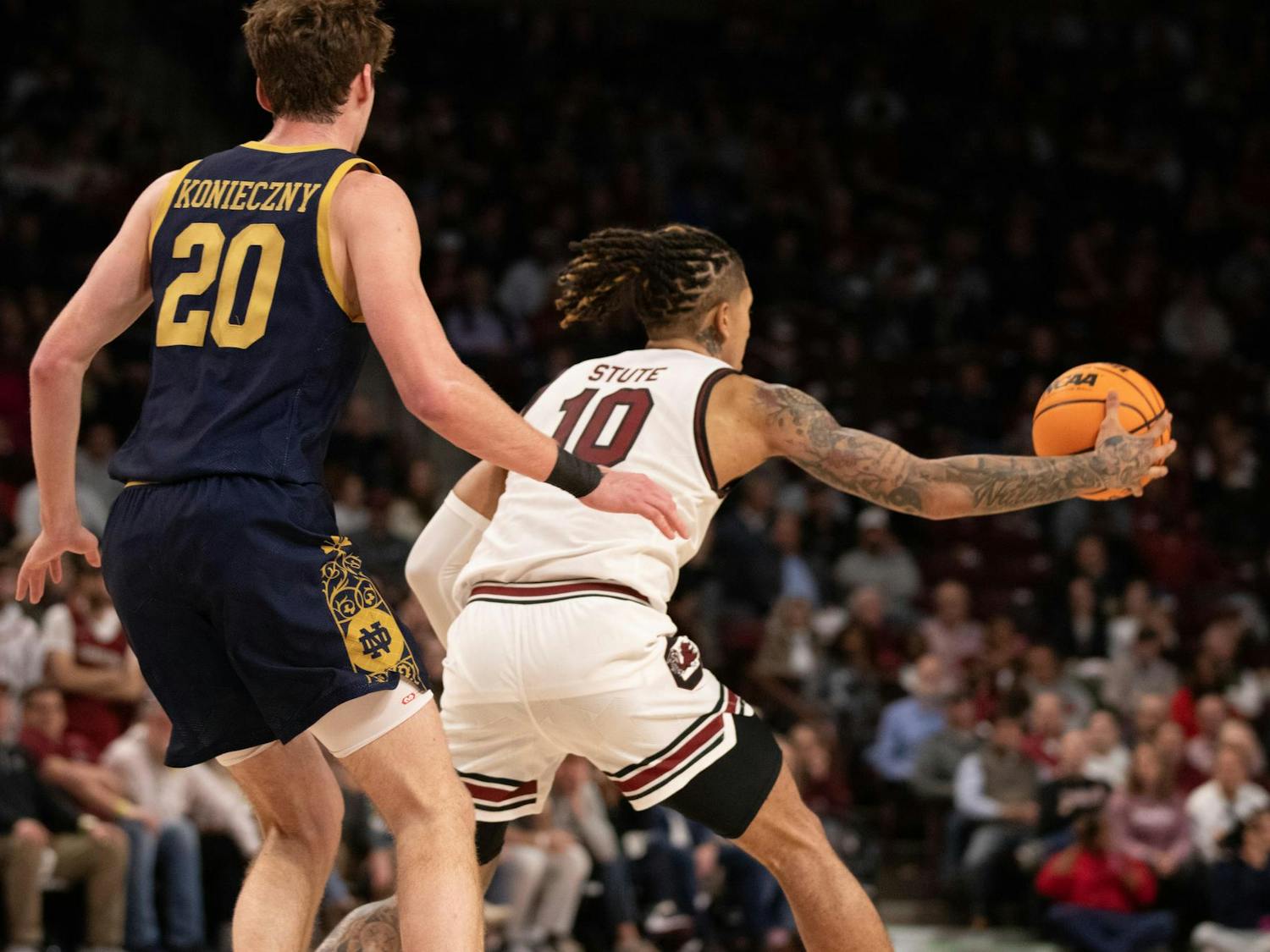 Junior guard Myles Stute catches a pass from his teammate and begins to set up the offense during a game on Nov. 28, 2023. Stute contributed one block but missed all of his field goals as South Carolina beat Notre Dame 65-53.