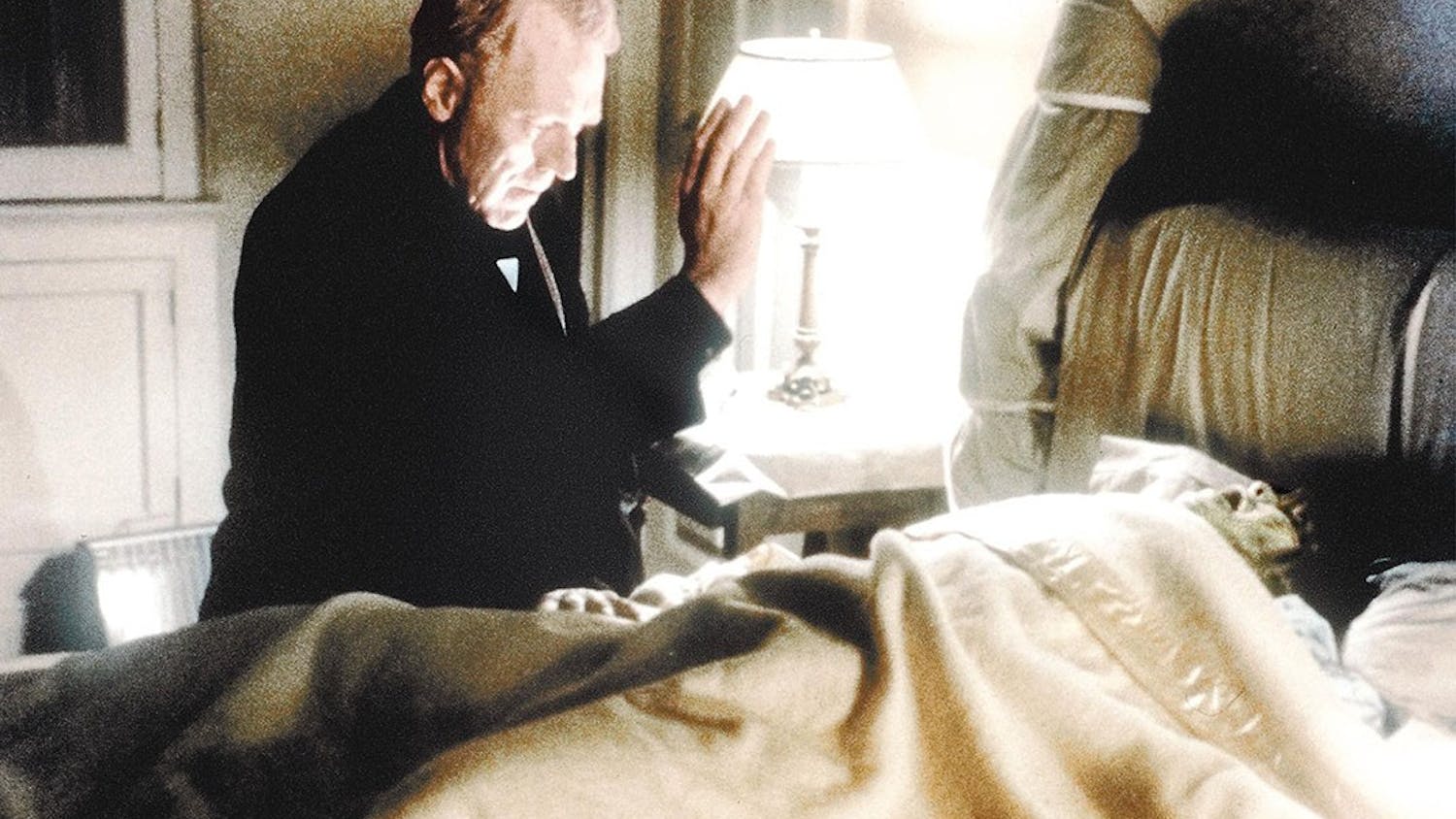Father Merrin, played by Max von Sydow, seeks the inner demon in Regan (Linda Blair) in the 1973 film “The Exorcist.”