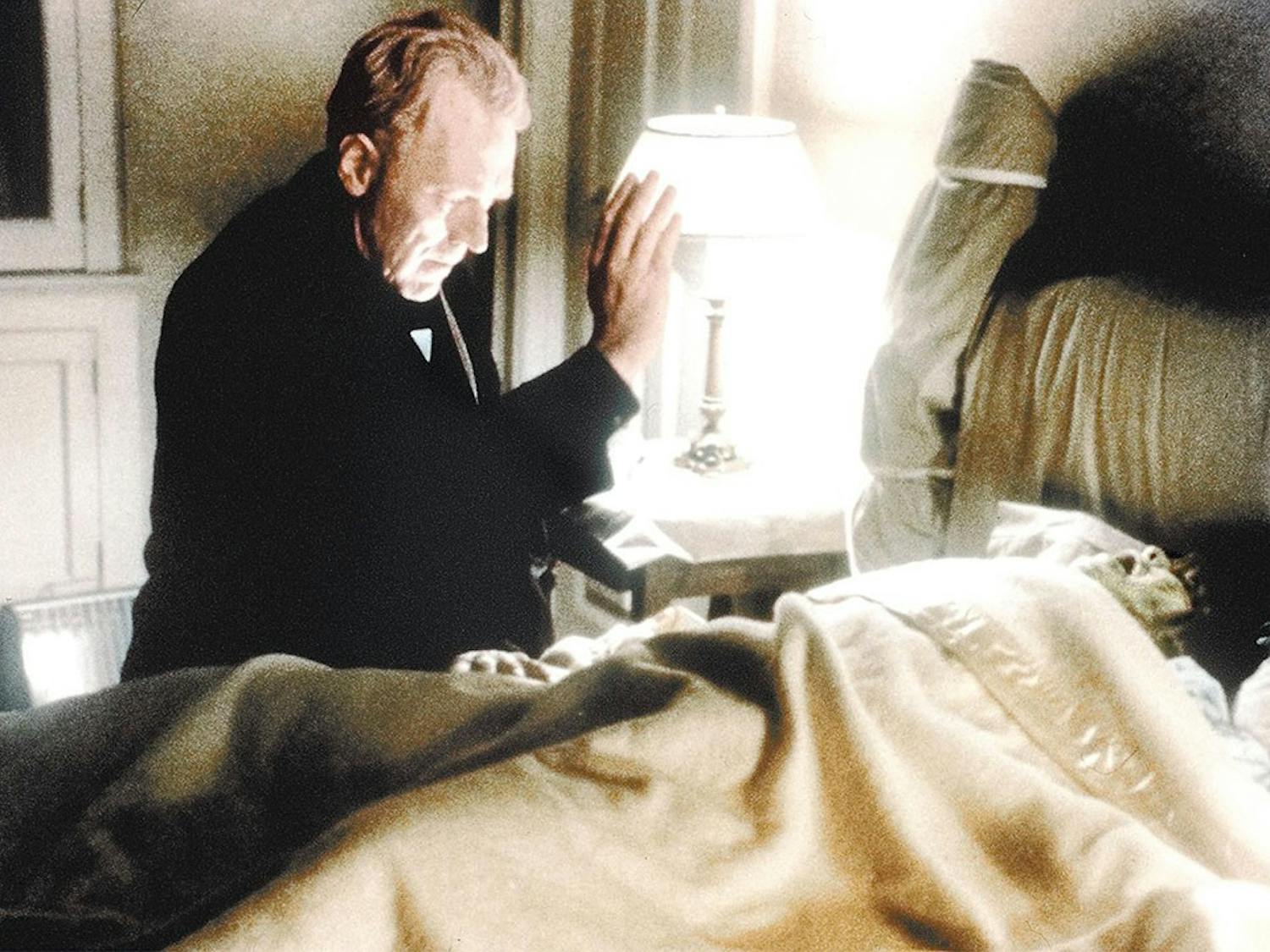 Father Merrin, played by Max von Sydow, seeks the inner demon in Regan (Linda Blair) in the 1973 film “The Exorcist.”