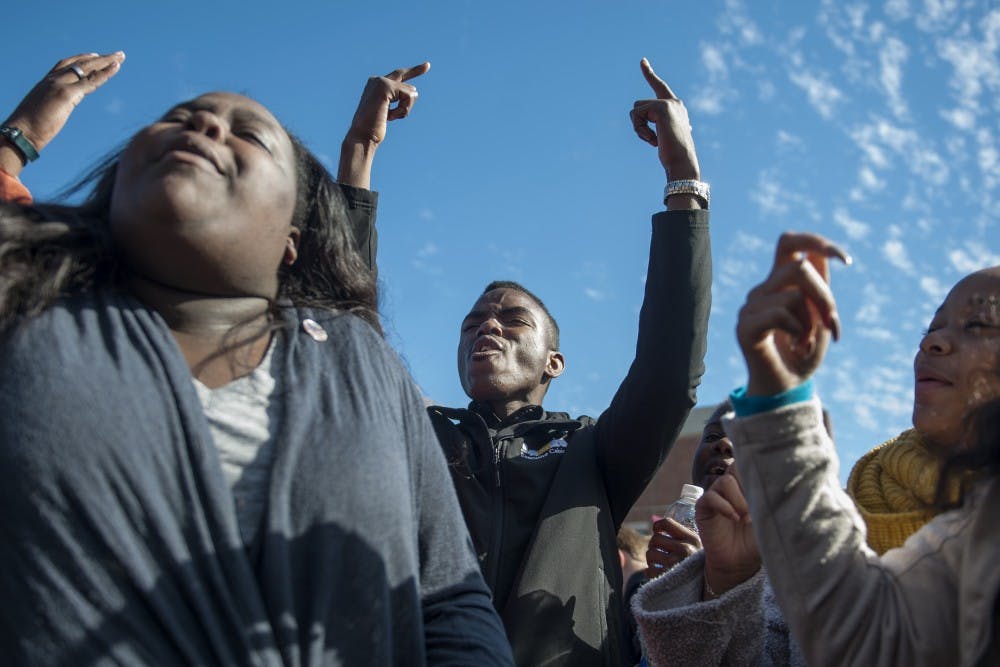 Peyton Head rejoices after hearing news of UM System President Tim Wolfe's resignation during the Concerned Students 1950 protest on Monday, Nov. 9 2015, in Columbia, Mo.