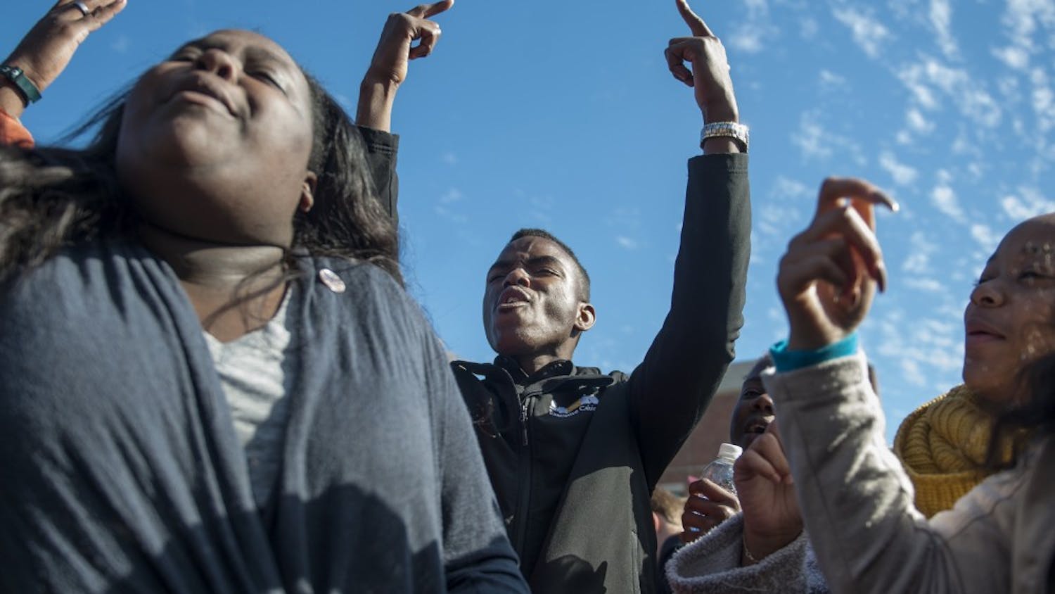 Peyton Head rejoices after hearing news of UM System President Tim Wolfe's resignation during the Concerned Students 1950 protest on Monday, Nov. 9 2015, in Columbia, Mo.
