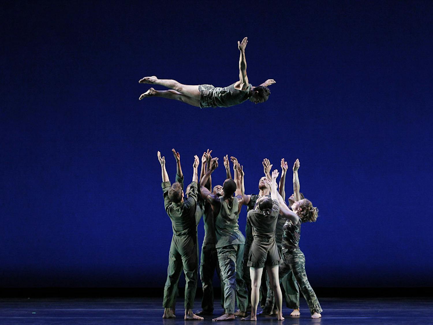 Members of the Bill T. Jones/Arnie Zane Company prepare to catch one of its dancers during the performance of Jones' "D-Man in the Waters." The dance group is working with the USC Dance Company to put together a show titled "Story/Time" that will debut at the Koger Center on April 1 and 2, 2023.