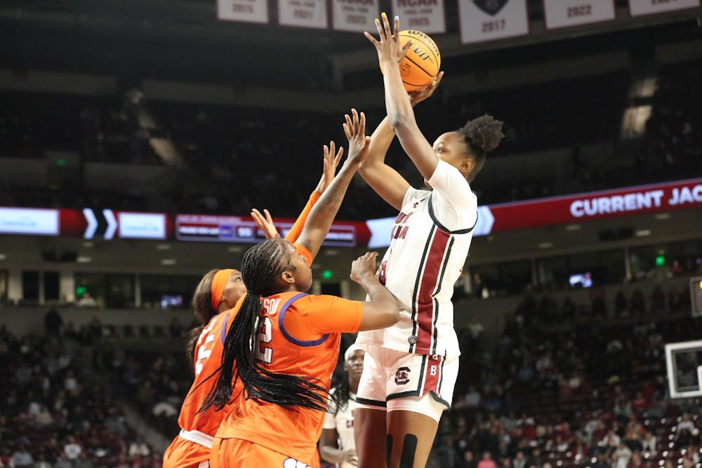 <p>FILE — Sophomore forward Joyce Edwards shoots a jump shot over two defenders against Clemson University on Nov. 11, 2025, at Colonial Life Arena. Edwards finished 8-17 to help the Gamecocks secure their 65-37 win against the Tigers.</p>