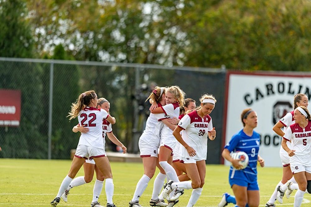 Members of the woman's soccer team celebrate after a goal against Kentucky. The Gamecocks beat the Wildcats 1-0.