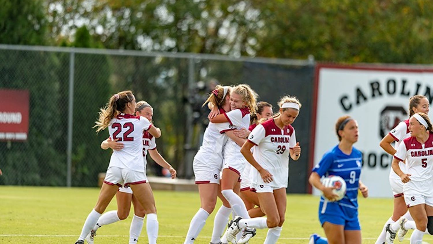 Members of the woman's soccer team celebrate after a goal against Kentucky. The Gamecocks beat the Wildcats 1-0.
