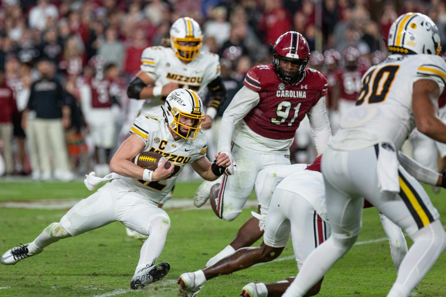 FILE - Sophomore quarterback Brady Cook attempts to sneak the ball down the field during the South Carolina vs. Missouri game on Oct. 29, 2022. The Tigers beat the ɫɫƵs 23-10.