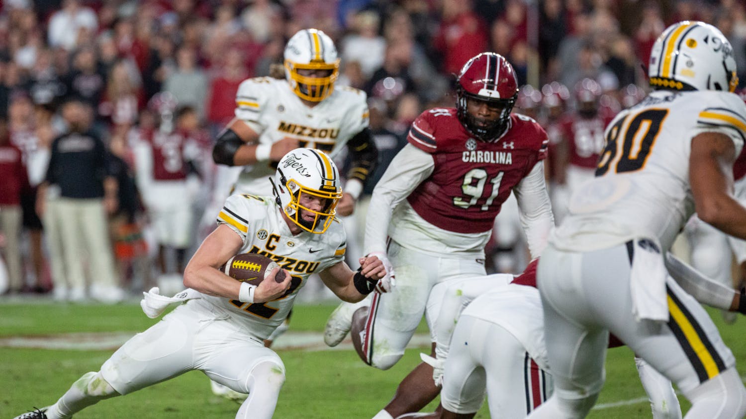 FILE - Sophomore quarterback Brady Cook attempts to sneak the ball down the field during the South Carolina vs. Missouri game on Oct. 29, 2022. The Tigers beat the Gamecocks 23-10.