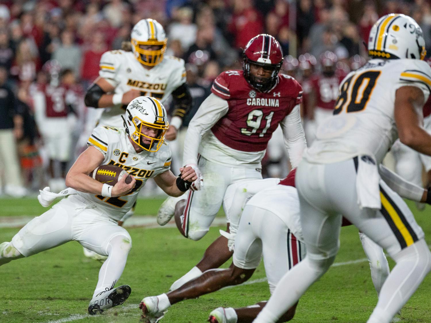 FILE - Sophomore quarterback Brady Cook attempts to sneak the ball down the field during the South Carolina vs. Missouri game on Oct. 29, 2022. The Tigers beat the Gamecocks 23-10.