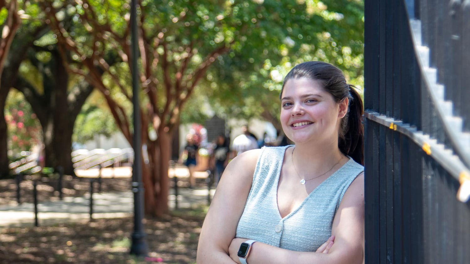 Kate Robins, editor-in-chief of The Daily Gamecock, poses for a photo in front of the gates on Greene Street on Aug. 19, 2024. Robins, a senior at the University of South Carolina, encourages people to take on new experiences and opportunities.