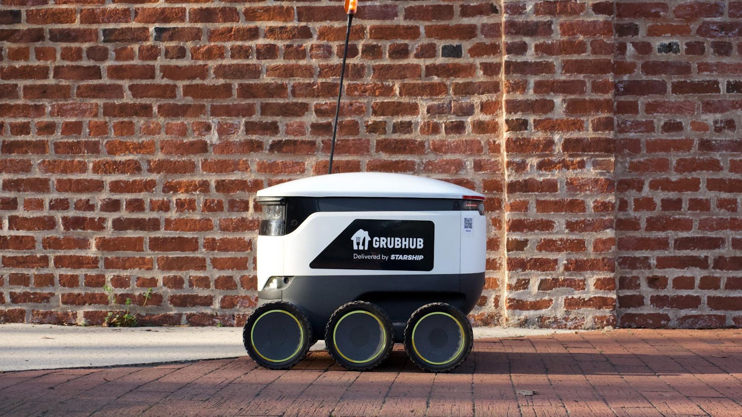 A University of South Carolina Grubhub robot zooming along Greene Street on Feb. 25, 2024. The university has implemented a new food delivery system for students to use on campus where small, six-wheeled robots deliver them food at their request if ordered through the Grubhub app.