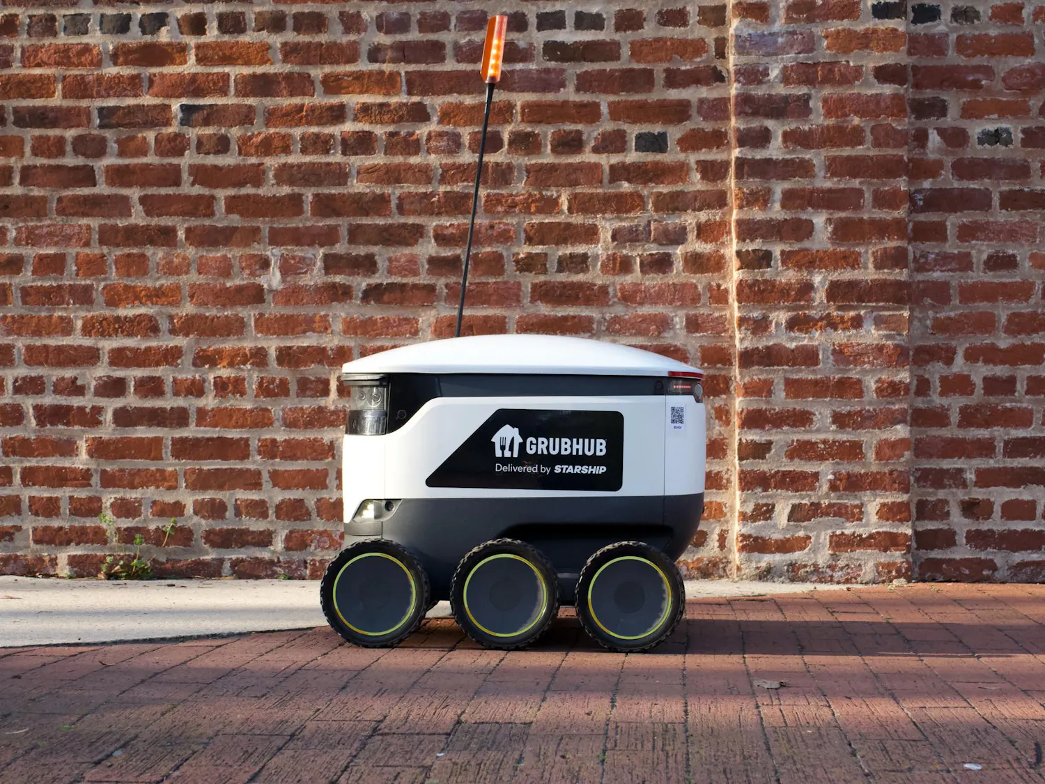 A University of South Carolina Grubhub robot zooming along Greene Street on Feb. 25, 2024. The university has implemented a new food delivery system for students to use on campus where small, six-wheeled robots deliver them food at their request if ordered through the Grubhub app.