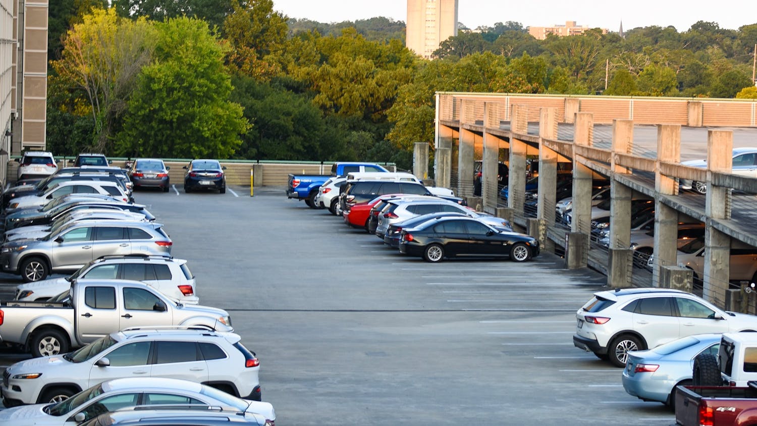 Cars parked on the top levels of the Bull Street Parking Garage. The university is expanding parking options toward the borders of campus to encourage walking and biking, which some students say further limits parking.&nbsp;