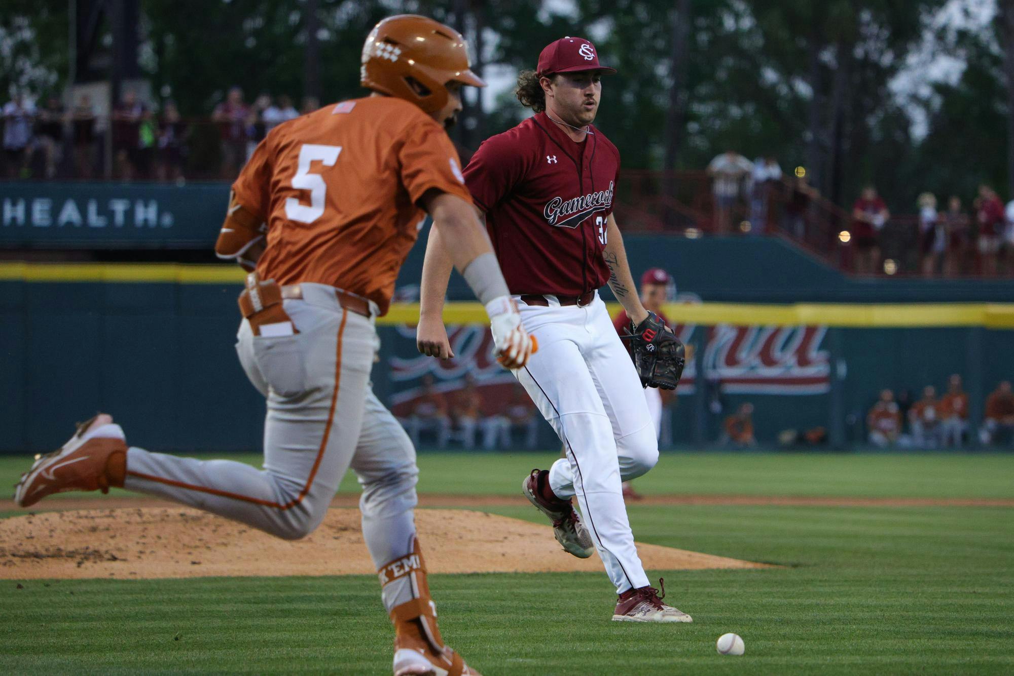 Junior right-handed pitcher Brandon Stone runs toward a bunted ball during South Carolina’s game against Texas at Founders Park on April 3, 2026. He moves off the mound to field the play.
