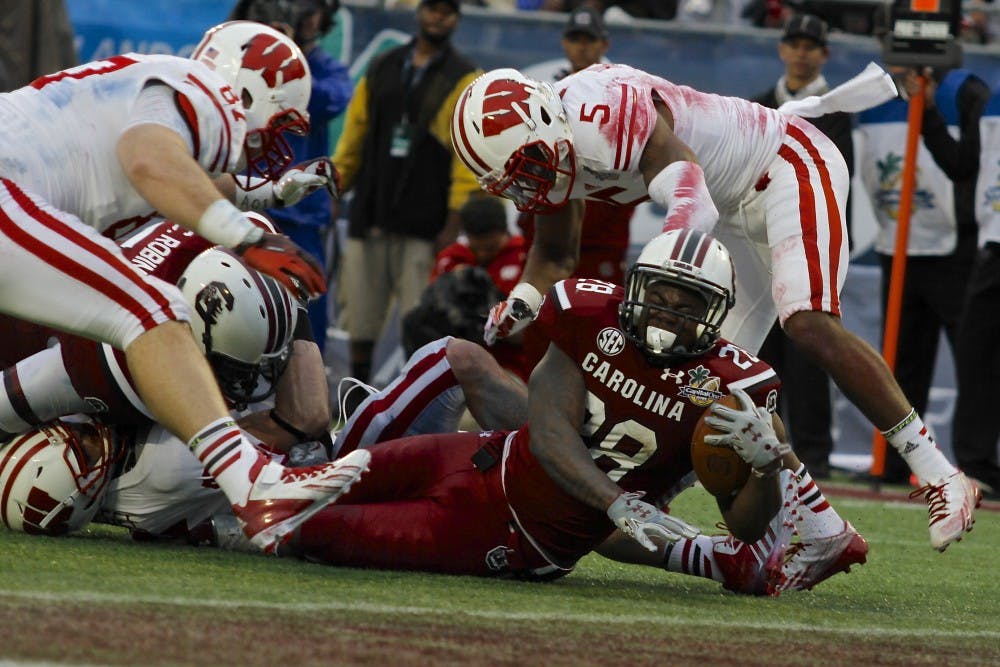 	Running back Mike Davis makes a run in the red zone in the Gamecocks&#8217; 34-24 win over Wisconsin at the Capital One Bowl on Jan. 1. He finished the day with 49 yards on nine carries.
