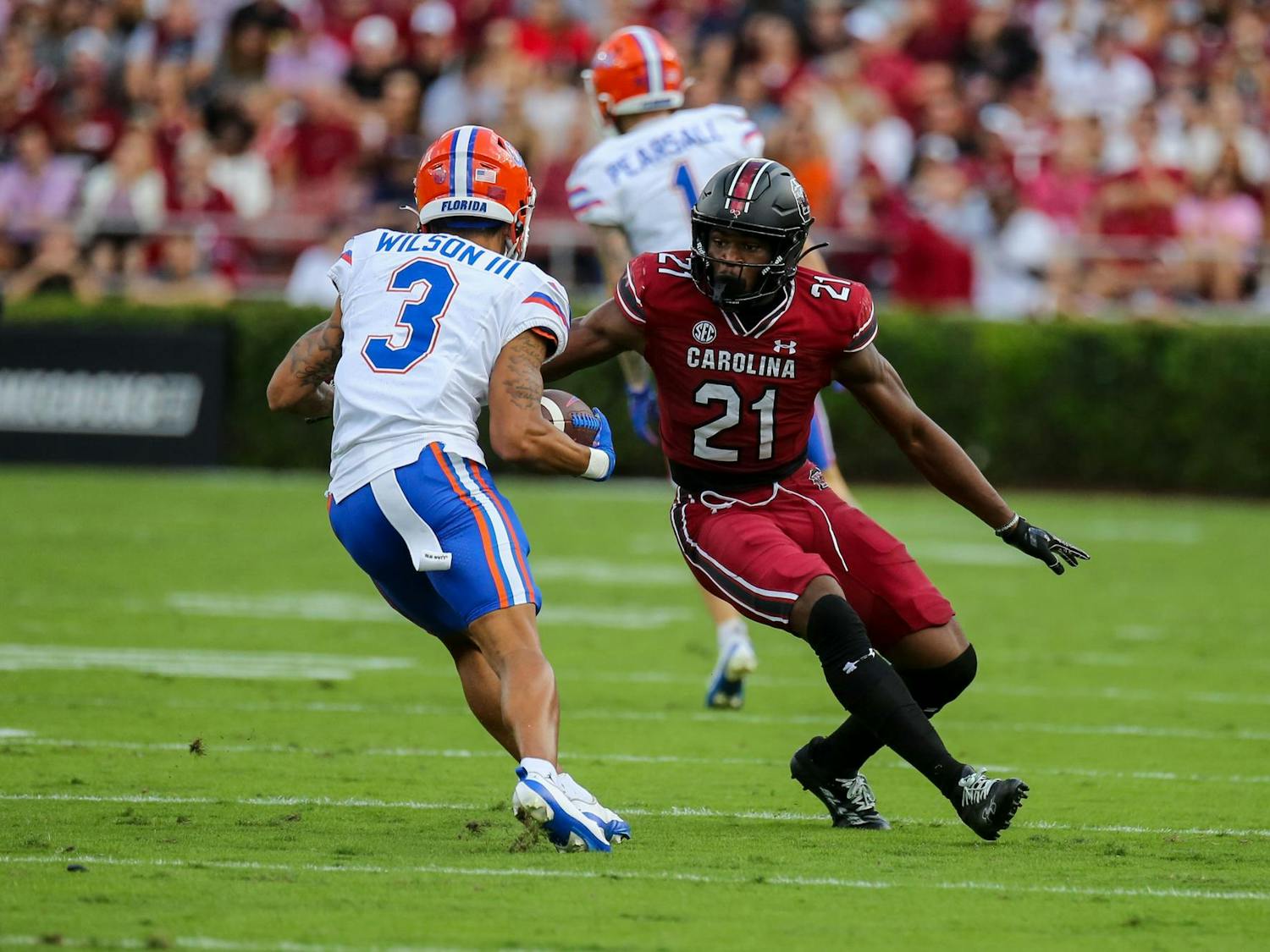 Sophomore defensive back Nick Emmanwori tries to tackle Florida freshman receiver Eugene Wilson III during the game on Oct. 14, 2023. The Gamecocks fell 41-39 after surrendering a late Gator touchdown.