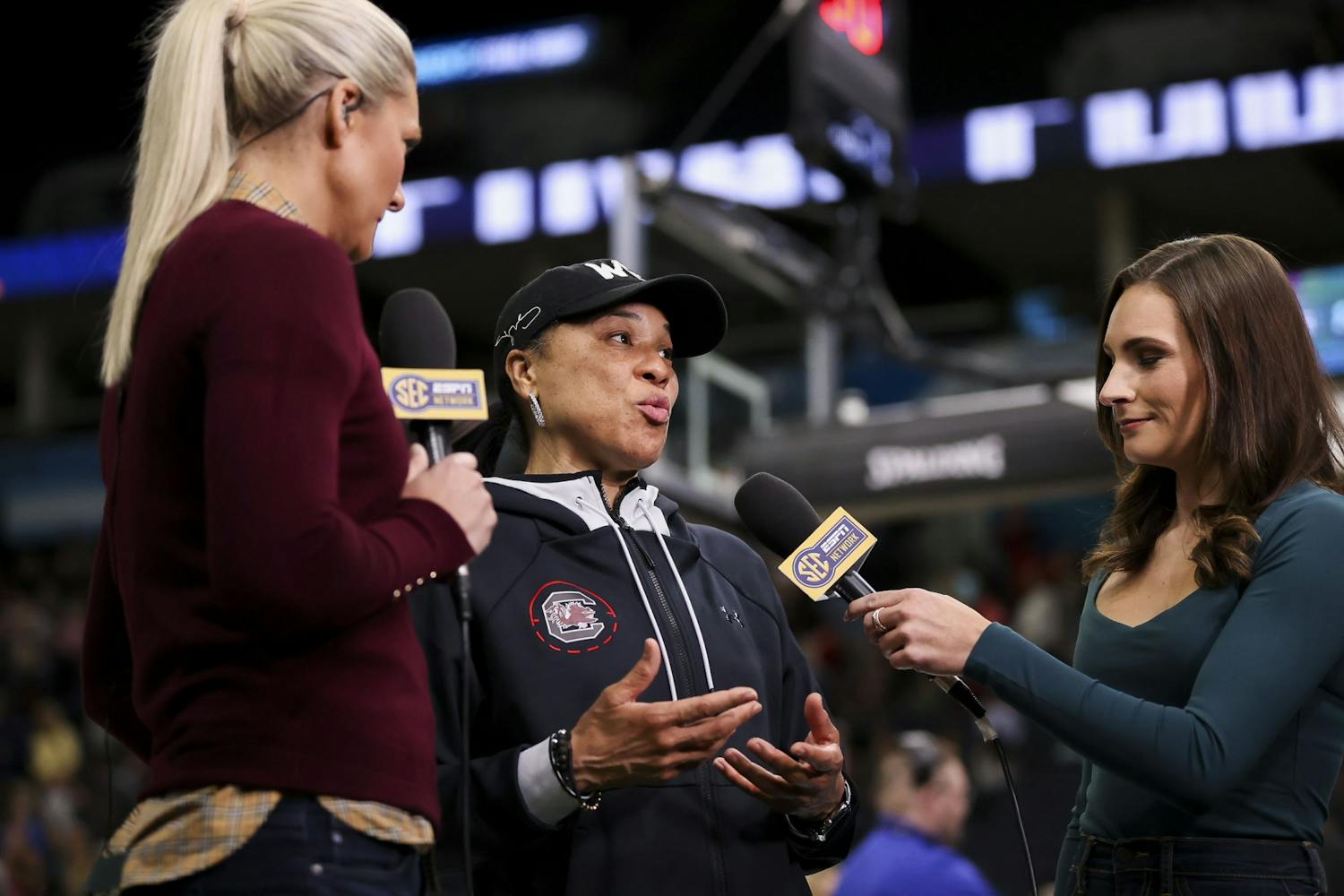 Head coach Dawn Staley speaks to 鶹С򽴫ý graduate Alyssa Lang and another SEC Network host after the Gamecocks' open practice on Saturday, April 2, 2022.