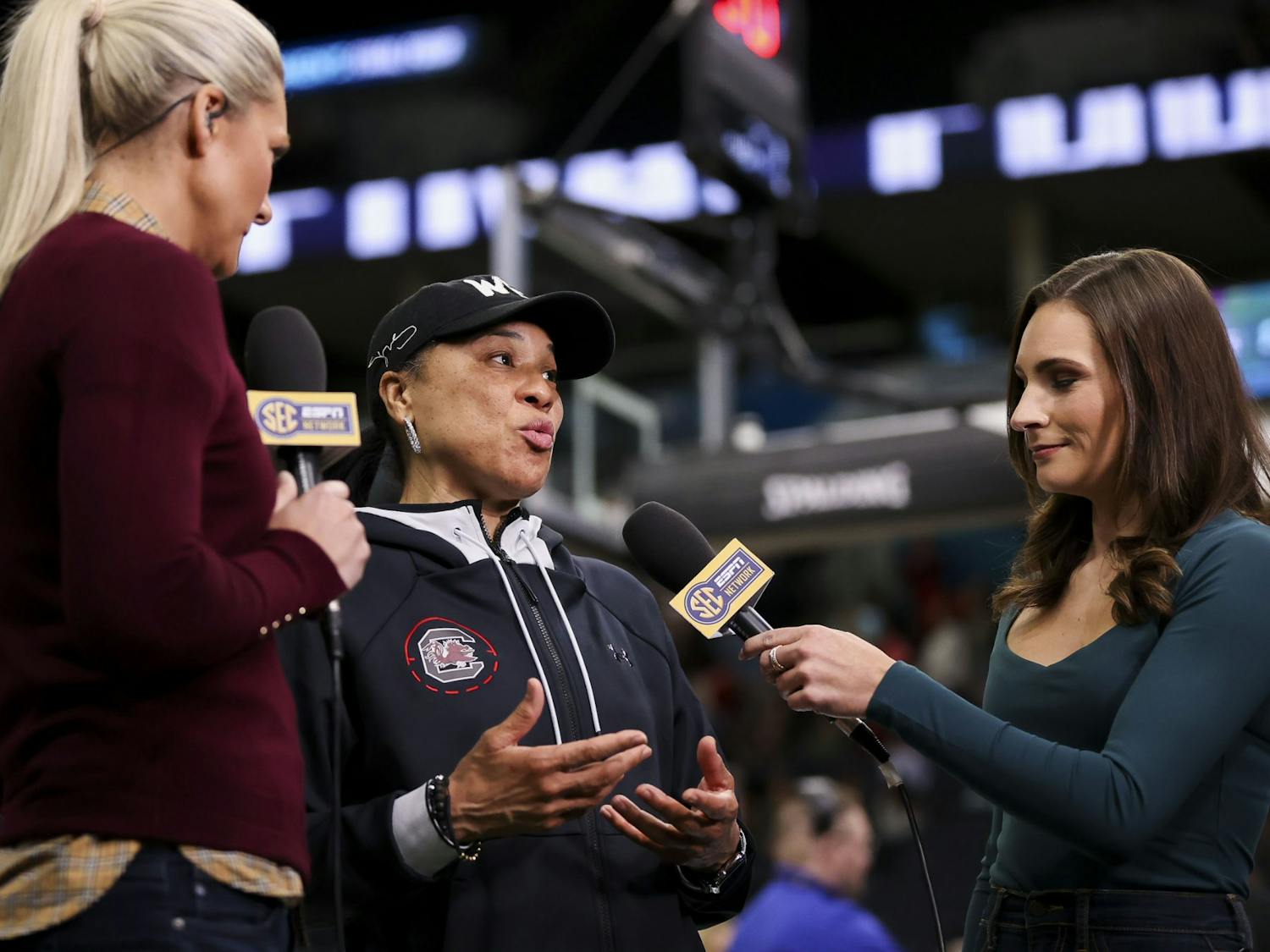 Head coach Dawn Staley speaks to USC graduate Alyssa Lang and another SEC Network host after the Gamecocks' open practice on Saturday, April 2, 2022.