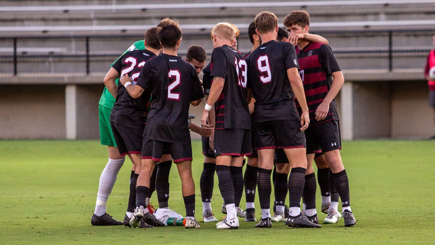 FILE— The men’s soccer team gathers together in a huddle before their game against Gardner-Webb on Sept. 28, 2021.