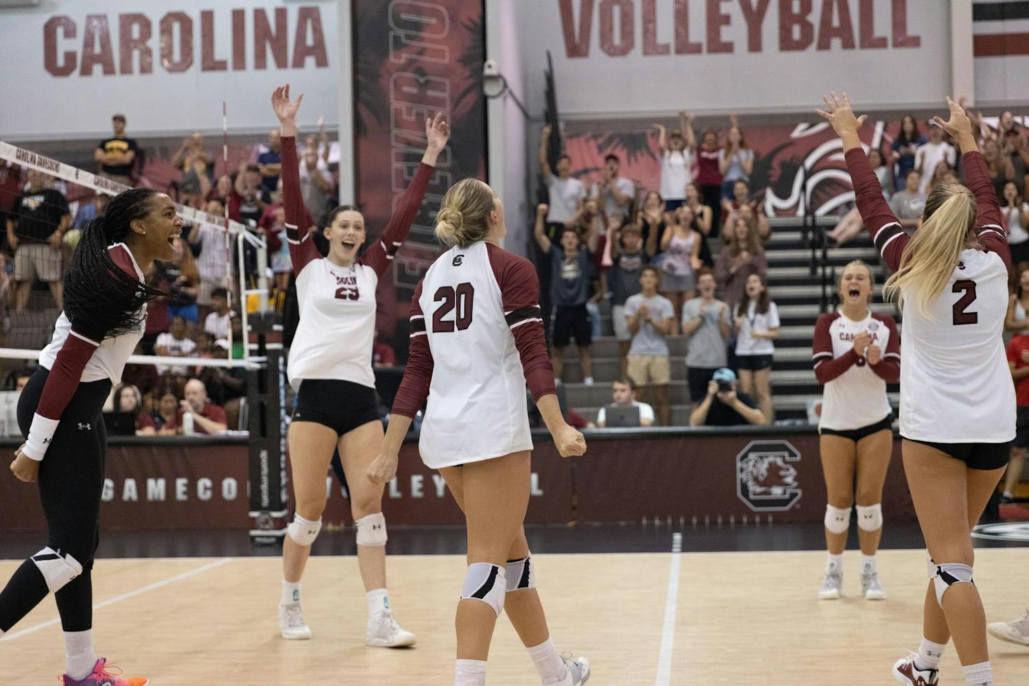 The 鶹С򽴫ý women's volleyball team celebrates earning a point during its match against Towson University on Aug. 26. The Gamecocks defeated the Tigers 3-1 after losing 3-0 earlier in the weekend.