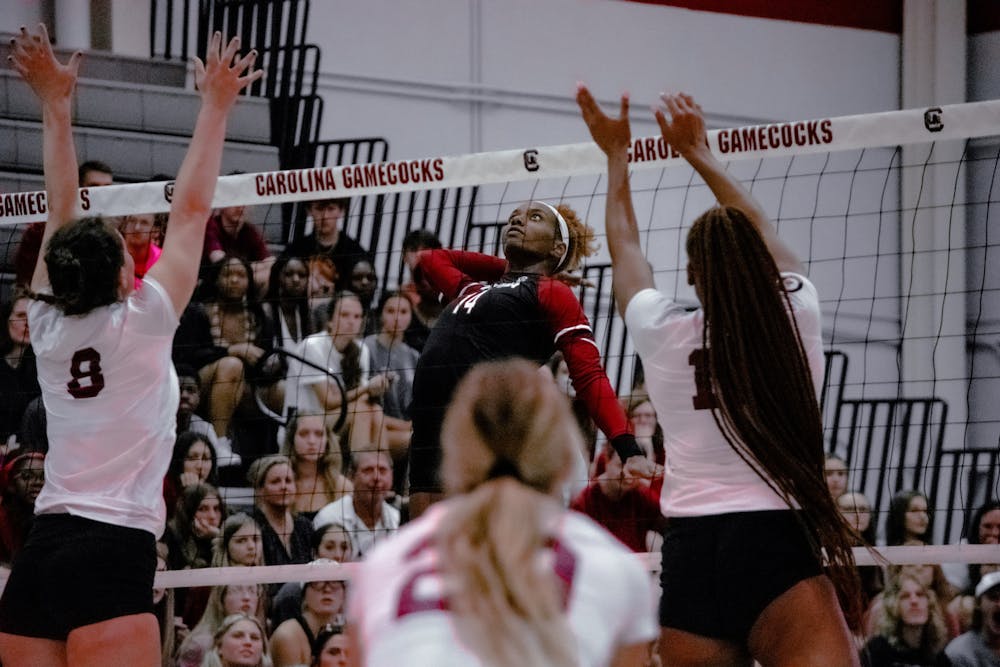 FILE— Junior outside hitter, Kiune Fletcher, leaps in the air for a strike against her opponents during a game against Winthrop on August, 27, 2022.
