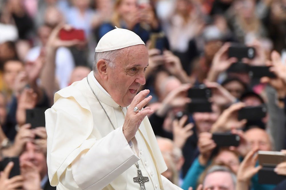Pope Francis waves to the waiting crowds on College Green, Dublin, during his visit to Ireland on Saturday, Aug. 25, 2018. The Pope said Thursday that unmarried couples must not be turned away from the Catholic Church. (Joe Giddens/PA Wire/Abaca Press/TNS)