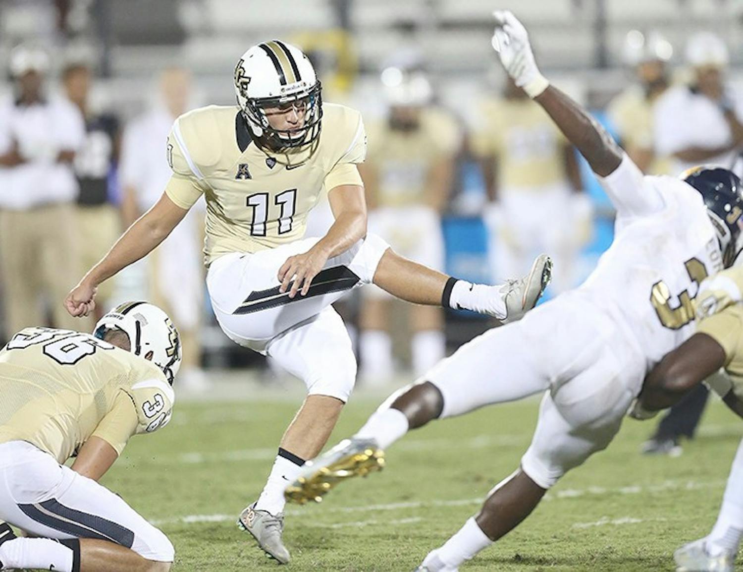 UCF kicker Matthew Wright (11) misses a field goal attempt with seconds left on the clock against Florida International at Bright House Networks Stadium in Orlando, Fla., on Thursday, Sept. 3, 2015. FIU won, 15-14. (Stephen M. Dowell/Orlando Sentinel/TNS)