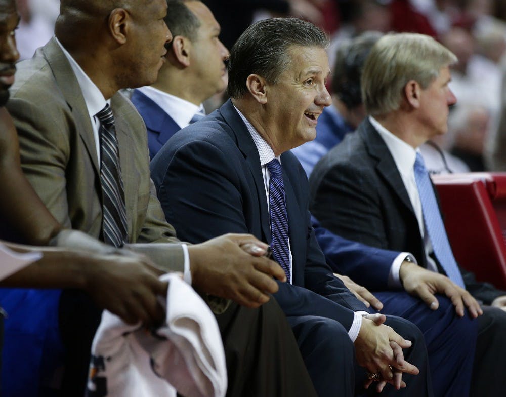 Kentucky head coach John Calipari enjoys the action late in an 80-66 win against Arkansas on Thursday, Jan. 21, 2016, at Bud Walton Arena in Fayetteville, Ark. (Mark Cornelison/Lexington Herald-Leader/TNS)