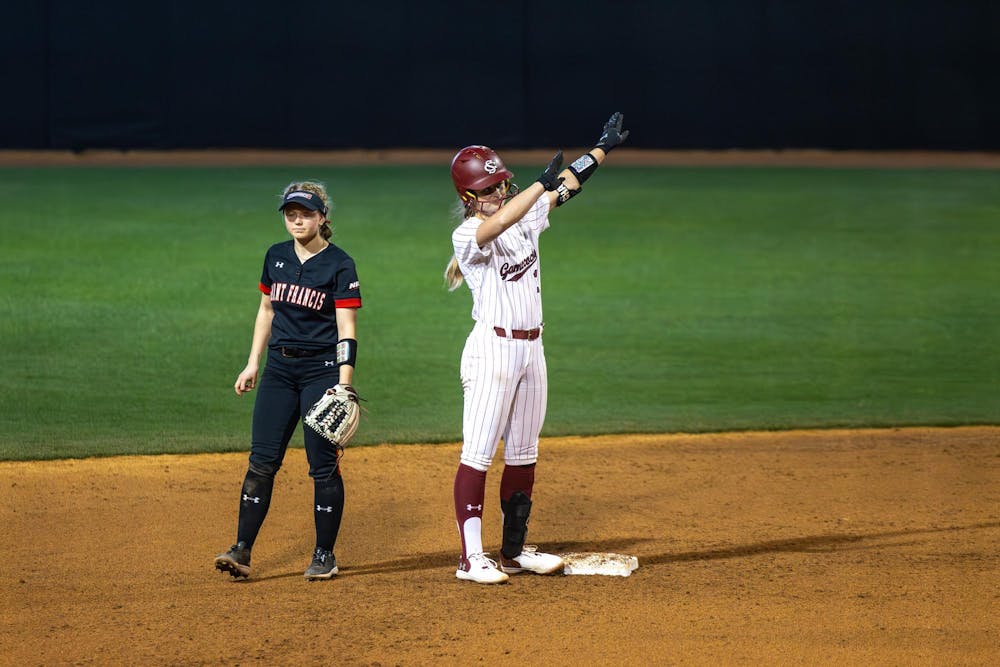 <p>FILE – Senior infielder Ella Chancey celebrates on second base after hitting a double and batting in a run against St. Francis on Feb. 8, 2025. Chancey transferred from Charlotte this year, following the new head coach and numerous other players.</p>