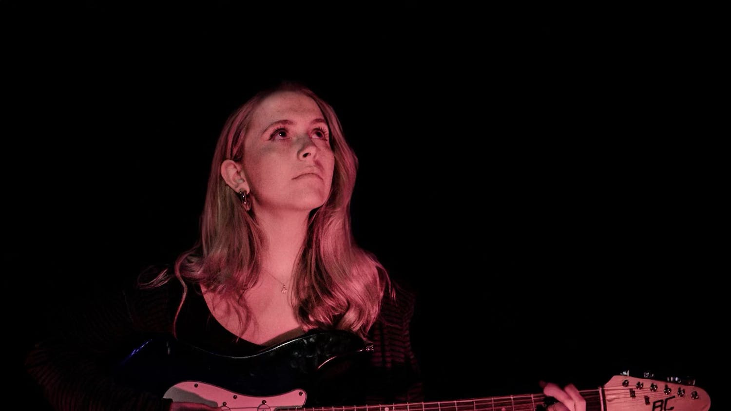 Second-year music industry studies student Katie DeMartini plays guitar as she poses for a photoshoot for Blossom Magazine in late Feb. 2025. Originally from New Jersey, DeMartini has performed locally around Columbia in her years as a student at the University of South Carolina.