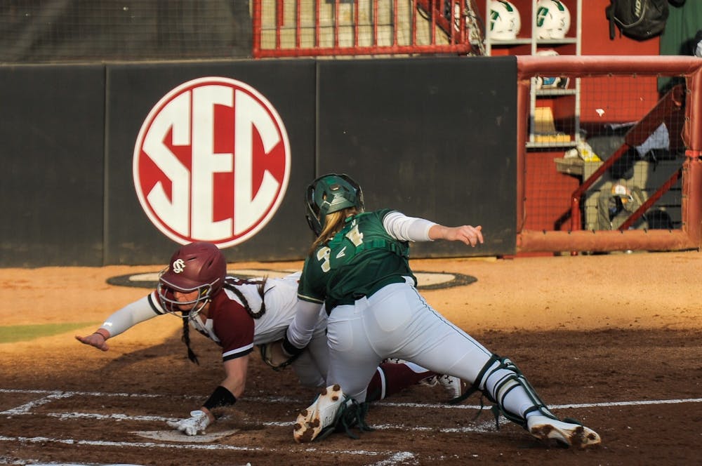 <p>Junior catcher Jordan Fabian gets tagged on her way to the plate during the game against the Charlotte 49ers on Wednesday Feb. 16, 2022. The Carolina Gamecocks lost to the Charlotte 49ers 6 to 1.</p>