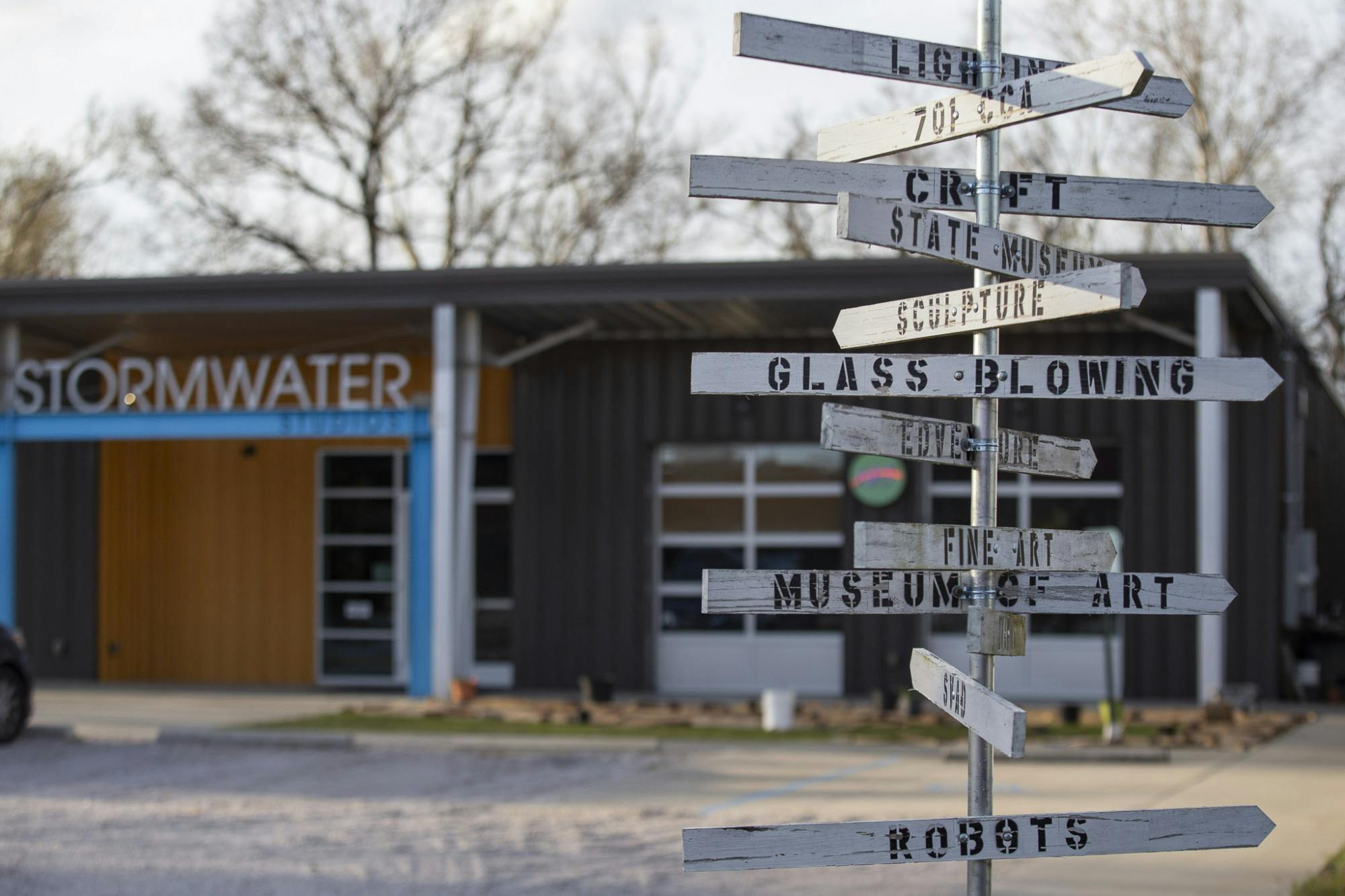 A sign pointing to the various art and culture studios and attractions in Columbia, South Carolina stands outside Stormwater Studios on Feb. 19, 2023. The art studio will be hosting award-winning photographer, filmmaker and documentarian Gerry Melendez's exhibition titled "Whole" from Feb. 21 to March 5, 2023.&nbsp;