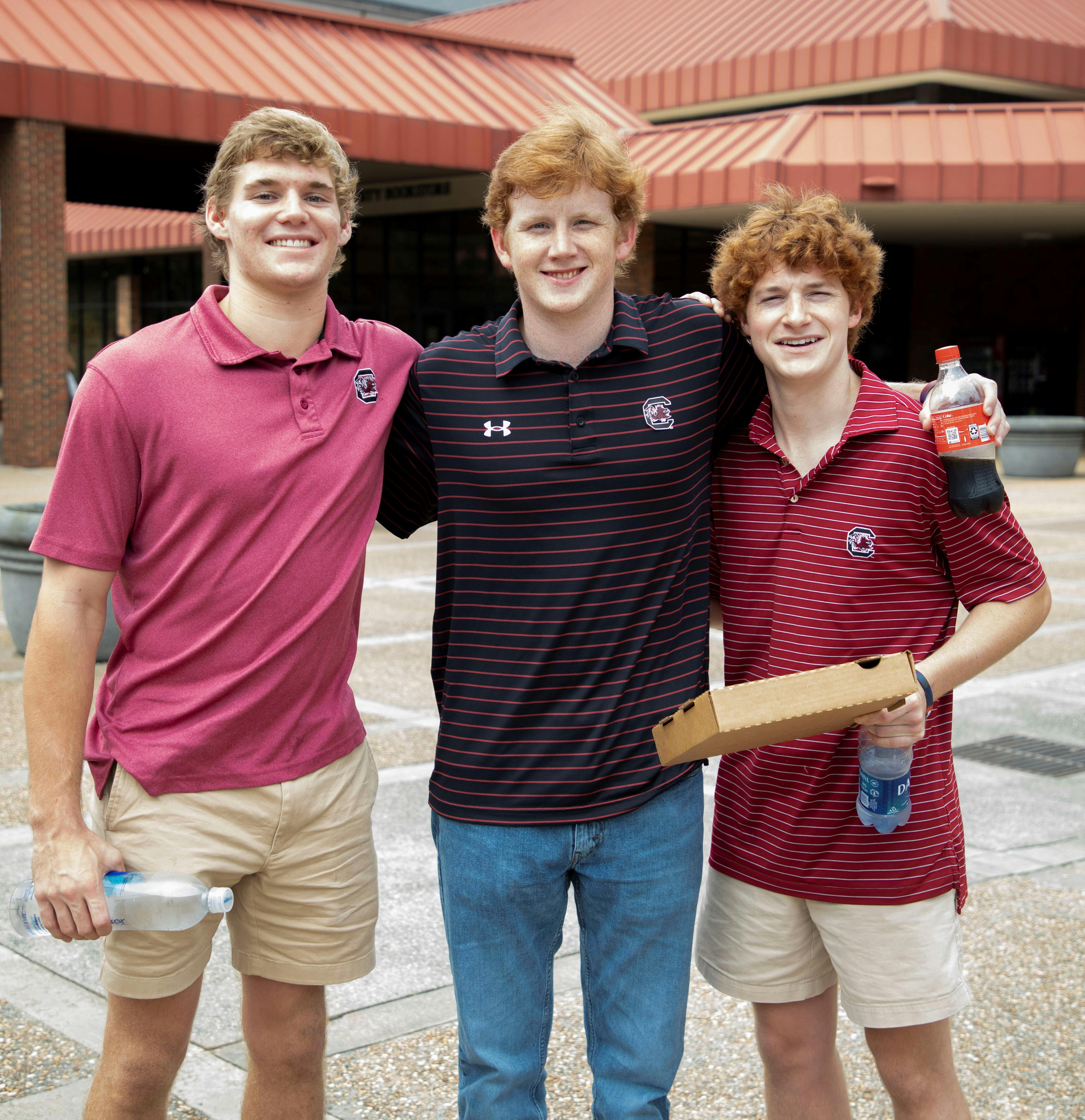 Carson Shay and Jason and Ryan Hill, Gamecock fans, at the Sanford Stadium before the Georgia vs. South Carolina game Saturday, Sept. 18, 2021.