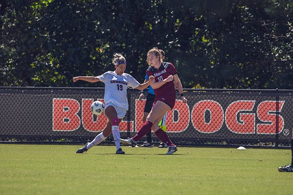 Freshman forward Catherine Barry dribbles around a defender in the 2020 season game against Georgia. Barry is one of eight freshmen on the Gamecocks' roster.