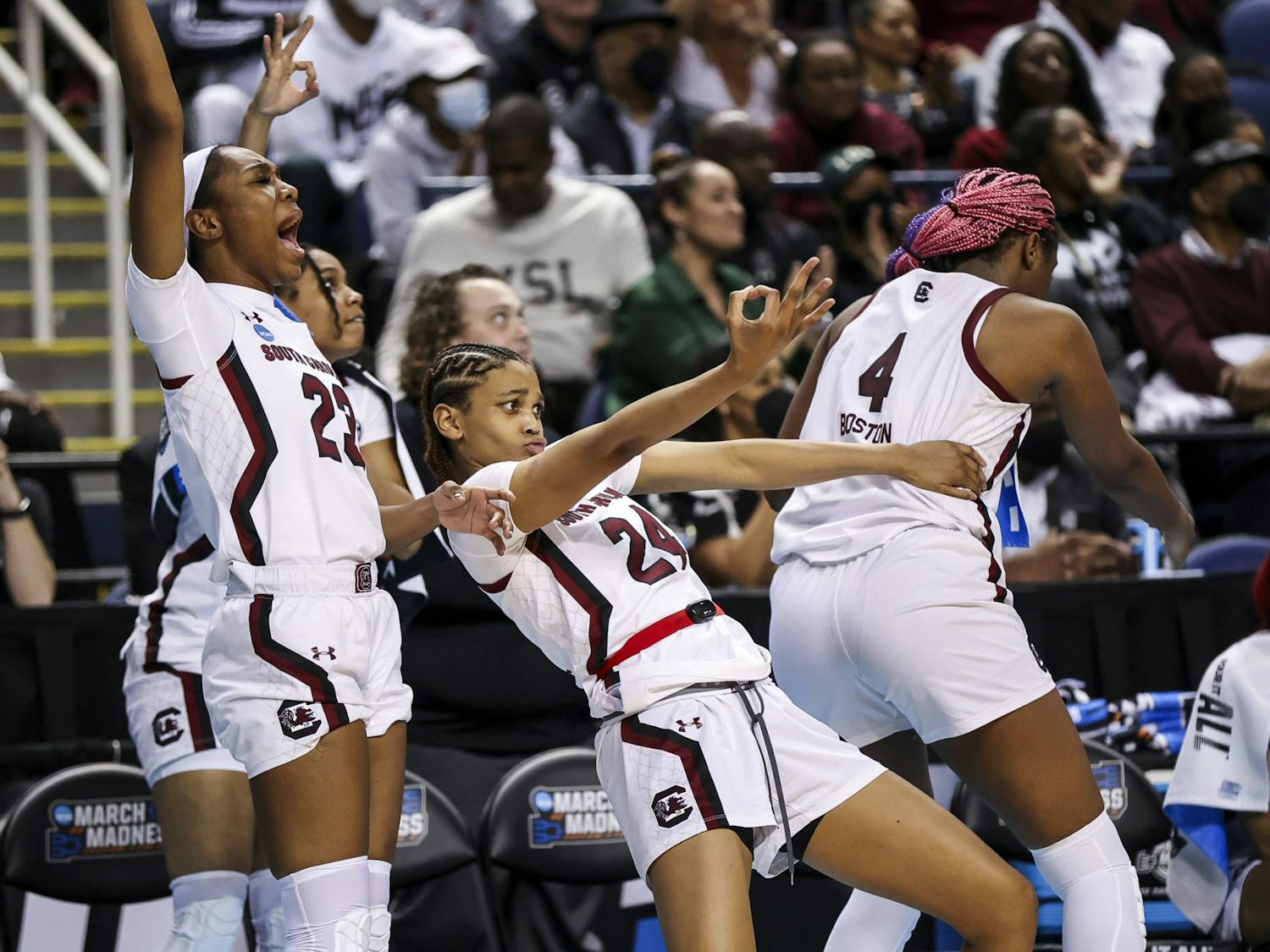 South Carolina bench celebrates a three-pointer during the fourth quarter of South Carolina's 80-50 victory over Creighton in the Elite Eight on Sunday, March 27, 2022. The win propelled the team to the Final Four.&nbsp;