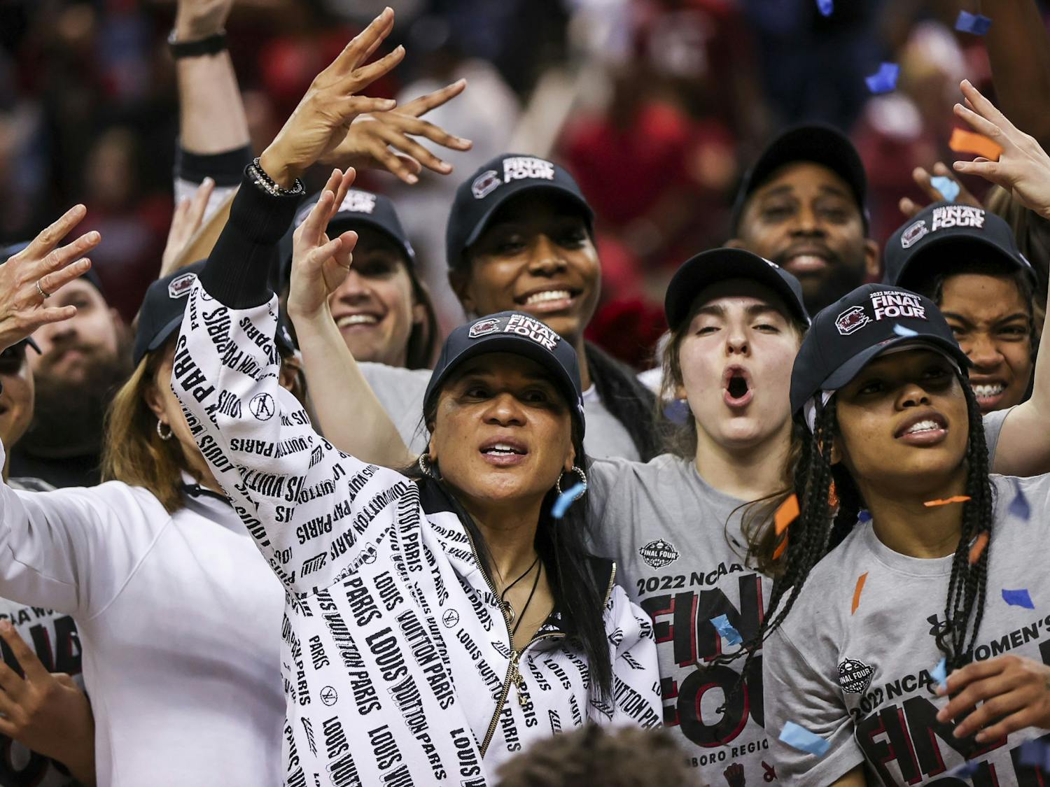 Head Coach Dawn Staley and South Carolina team celebrates after Gamecocks' 80-50 victory over Creighton in the Elite Eight on Sunday, March 27, 2022. The win propelled the team to the Final Four.&nbsp;