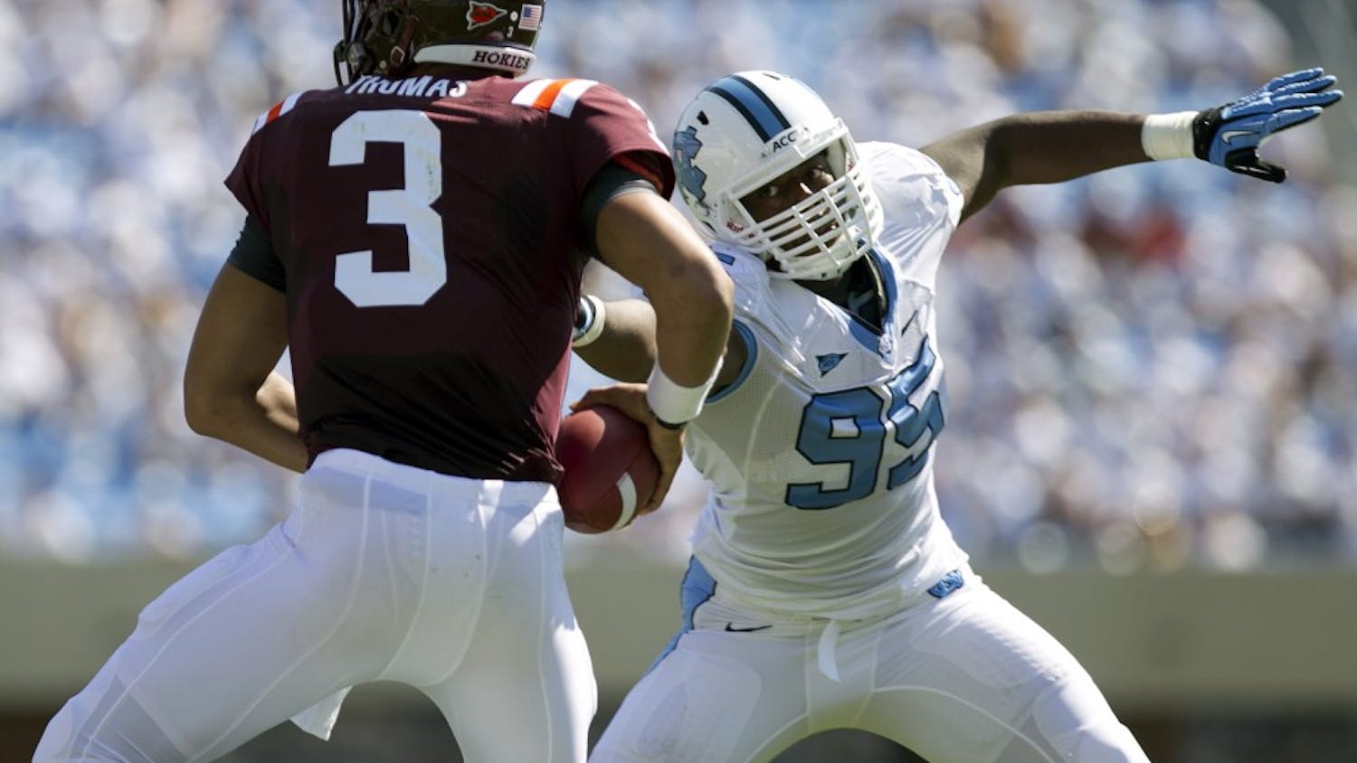 North Carolina's Kareem Martin (95) pressures Virginia Tech quarterback Logan Thomas (3) in the first quarter at Kenan Stadium in Chapel Hill, North Carolina, Saturday, October 6, 2012. UNC defeated Virginia Tech, 48-34. (Robert Willett/Raleigh News & Observer/MCT)