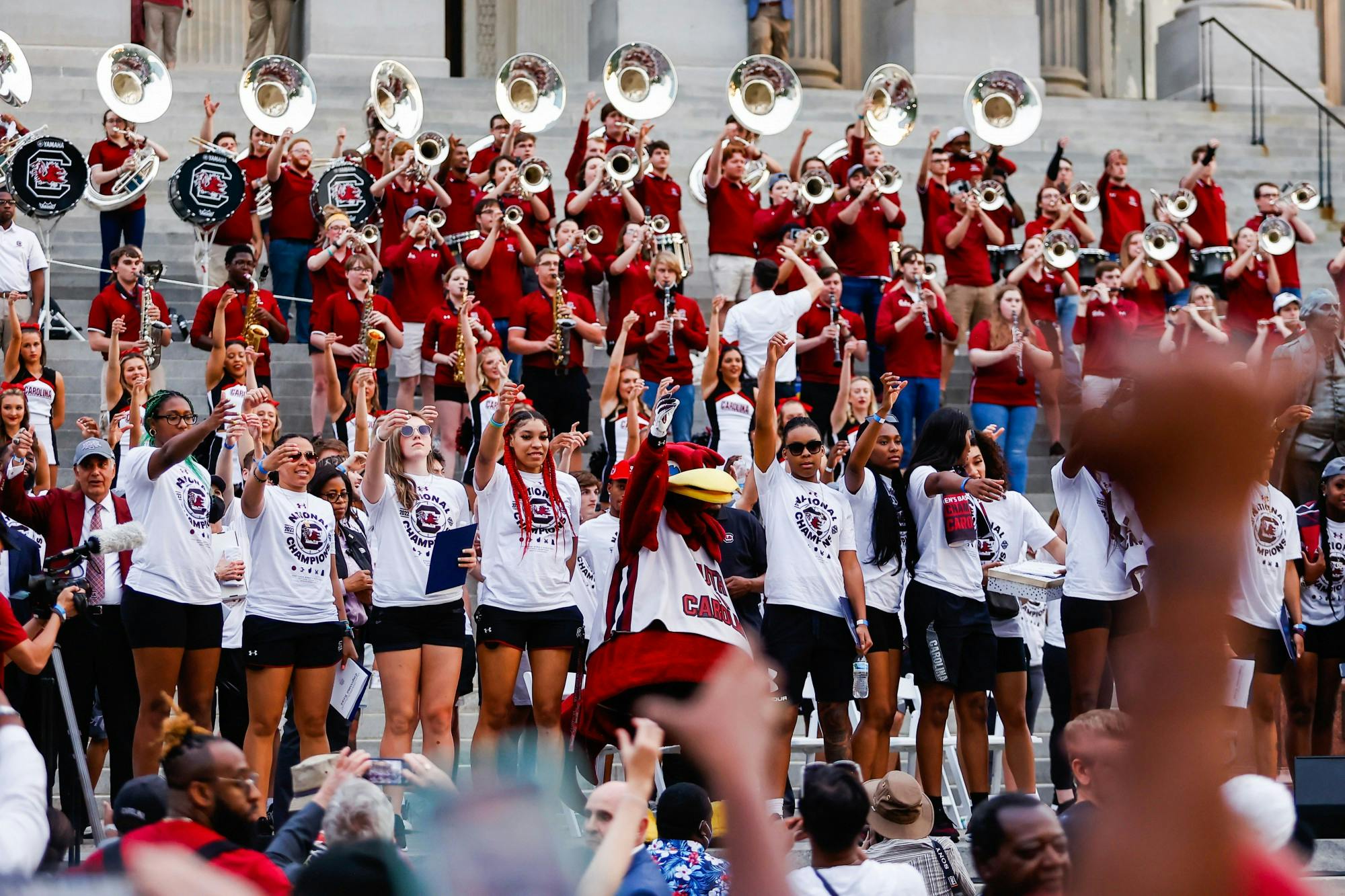 The Women’s Basketball teams “raise their cups” as the USC alma mater plays on April 13, 2022, after a parade in honor of the team’s national championship win. 