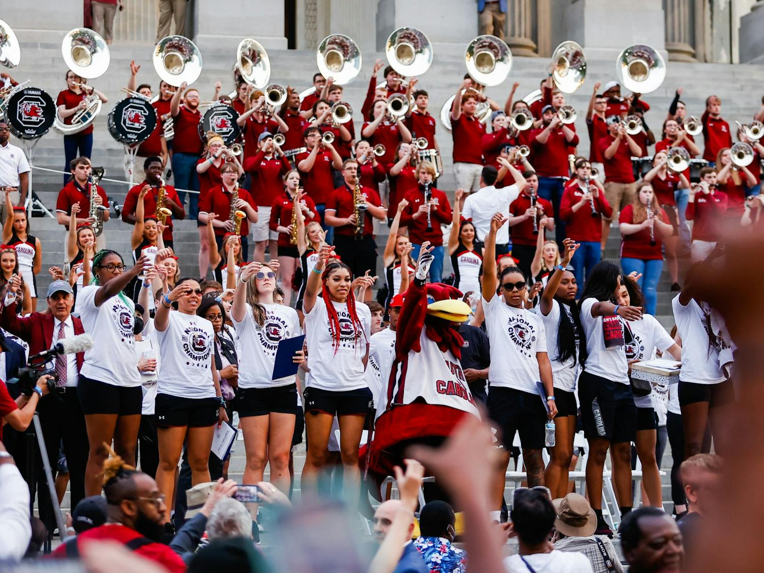 The Women’s Basketball teams “raise their cups” as the USC alma mater plays on April 13, 2022, after a parade in honor of the team’s national championship win. 