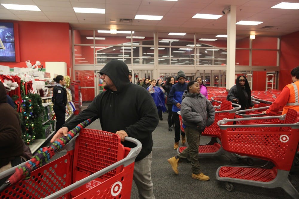 Shoppers enter to shop Black Friday sales at a Target store in Chicago on Thursday, Nov. 26, 2015. (Brian Nguyen/Chicago Tribune/TNS)