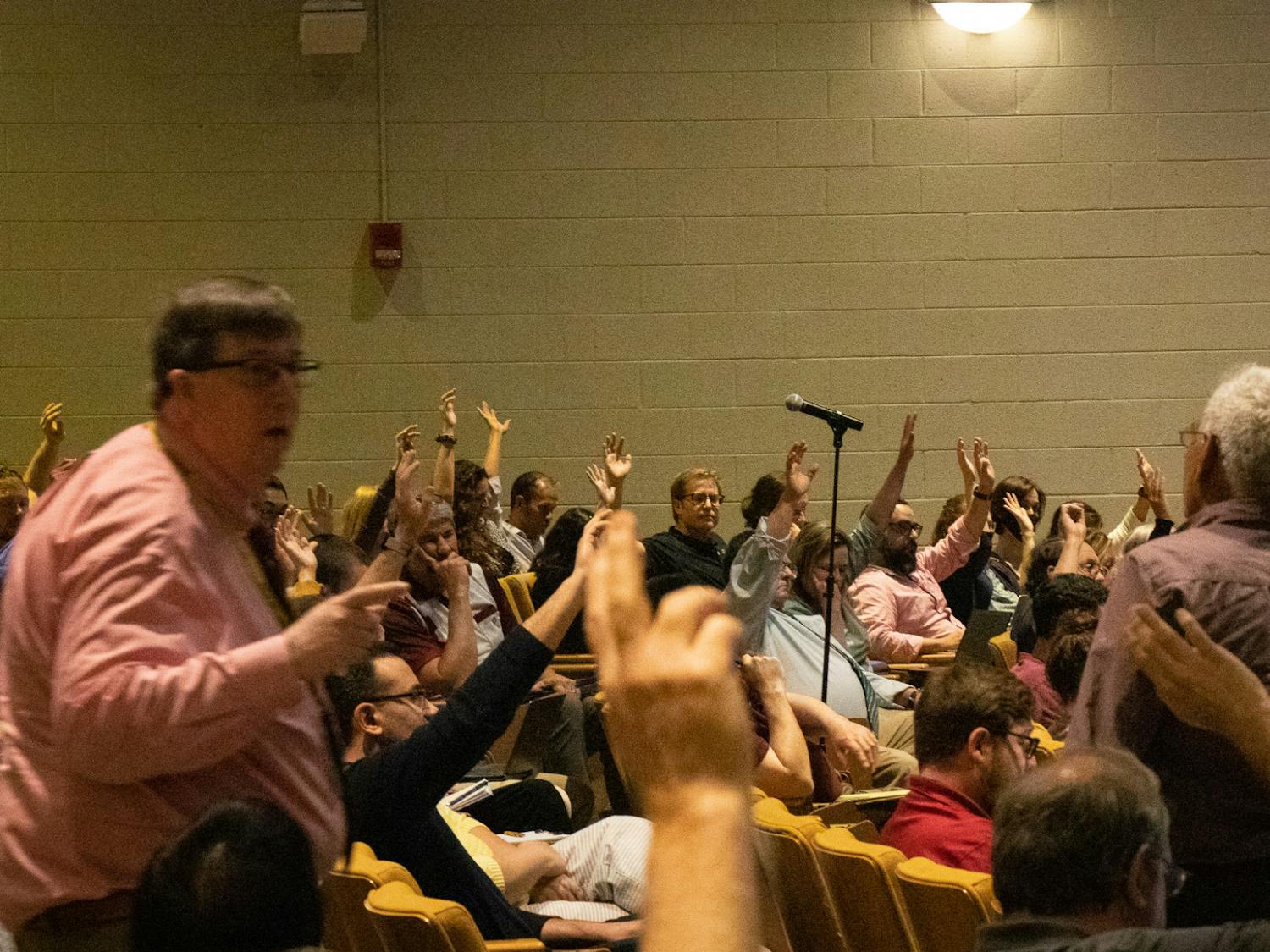 Nursing Professor and Faculty Senator Abbas Tavakoli helps Parliamentarian Bill Sudduth tally votes in favor of an amendment during a faculty senate on April 19, 2023, in the Booker T. Washington Auditorium. The amendment failed by a vote of 33 for and 41 against. &nbsp;