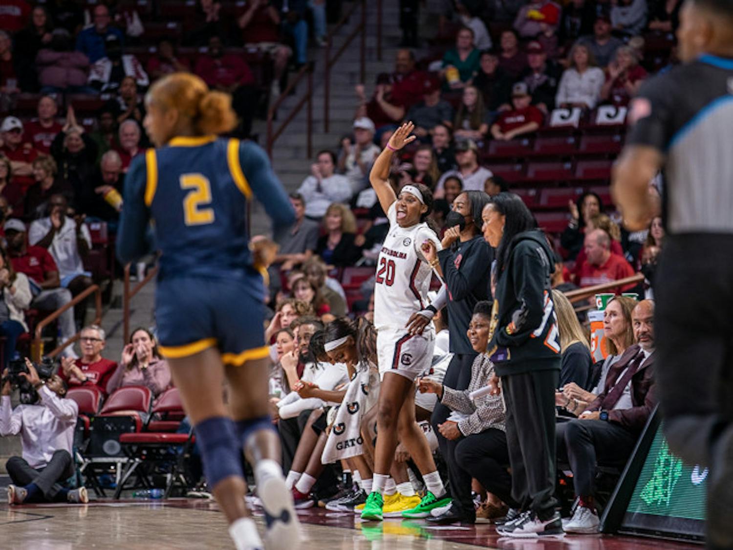 Sophomore Sania Feagin celebrates her teammate on the bench with her team. South Carolina beat East Tennessee State 101-31 on Nov. 7, 2022.