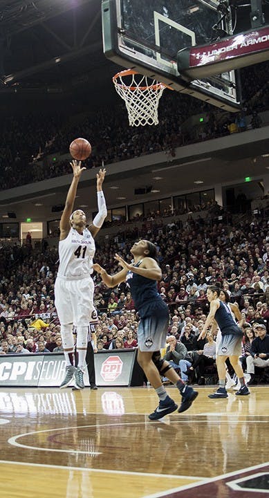 Aliana Coates shoots a basket in the first quarter and establishing a role in the game. Coates was consistent in making baskets through the game by pushing through the defense.
