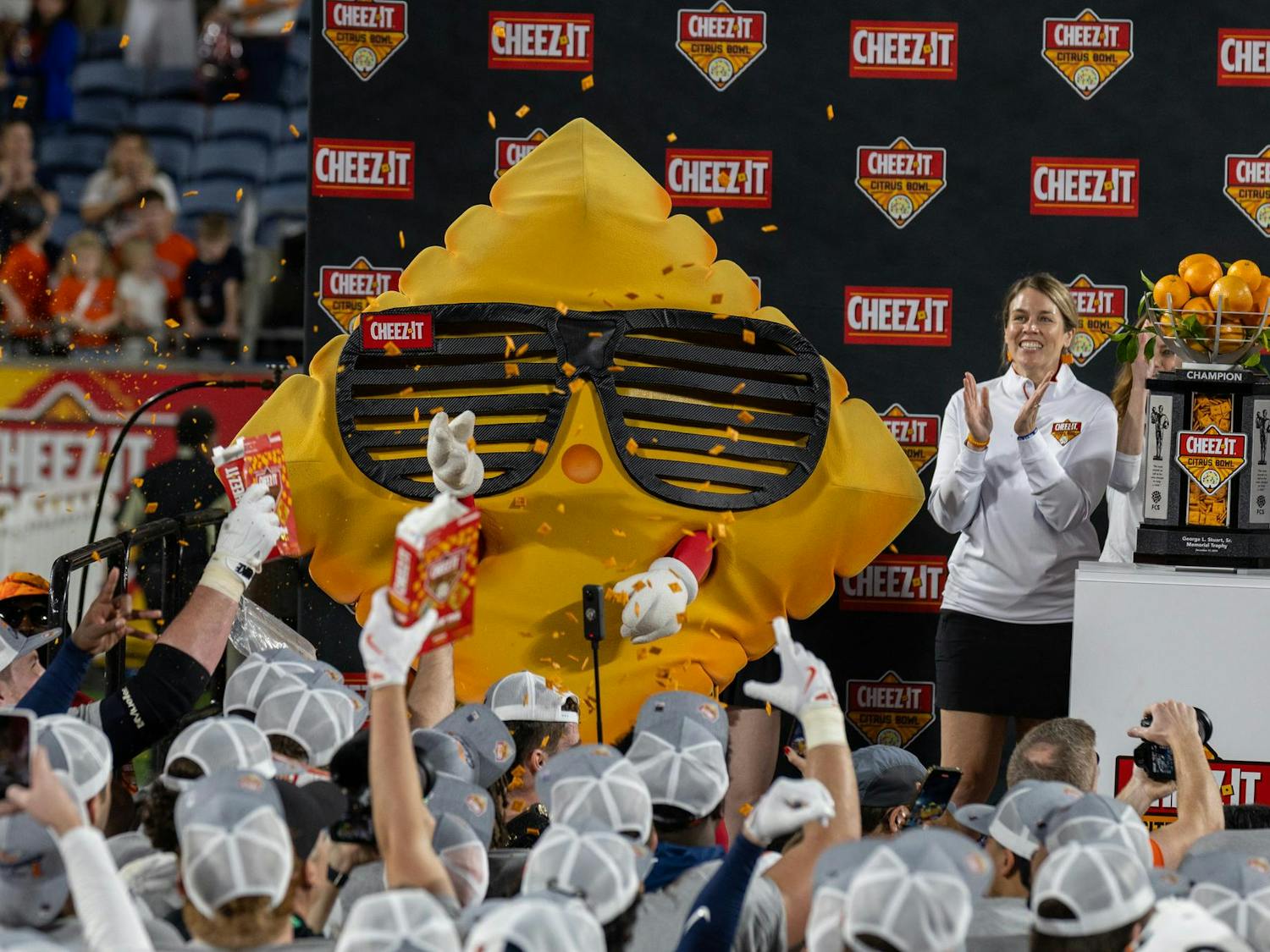 Cheez-It mascot Ched-Z celebrates with Illinois football players after they won the Cheez-It Citrus Bowl on Dec. 31, 2024. The Gamecocks were chosen to face the Fighting Illini at Camping World Stadium after a 9-3 regular season.