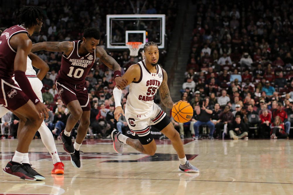 <p>FILE - Graduate student guard Ta’Lon Cooper drives the ball past a defender at Colonial Life Arena on Jan. 6, 2024. Cooper led the team with seven assists during the 68-62 win against Mississippi State.</p>