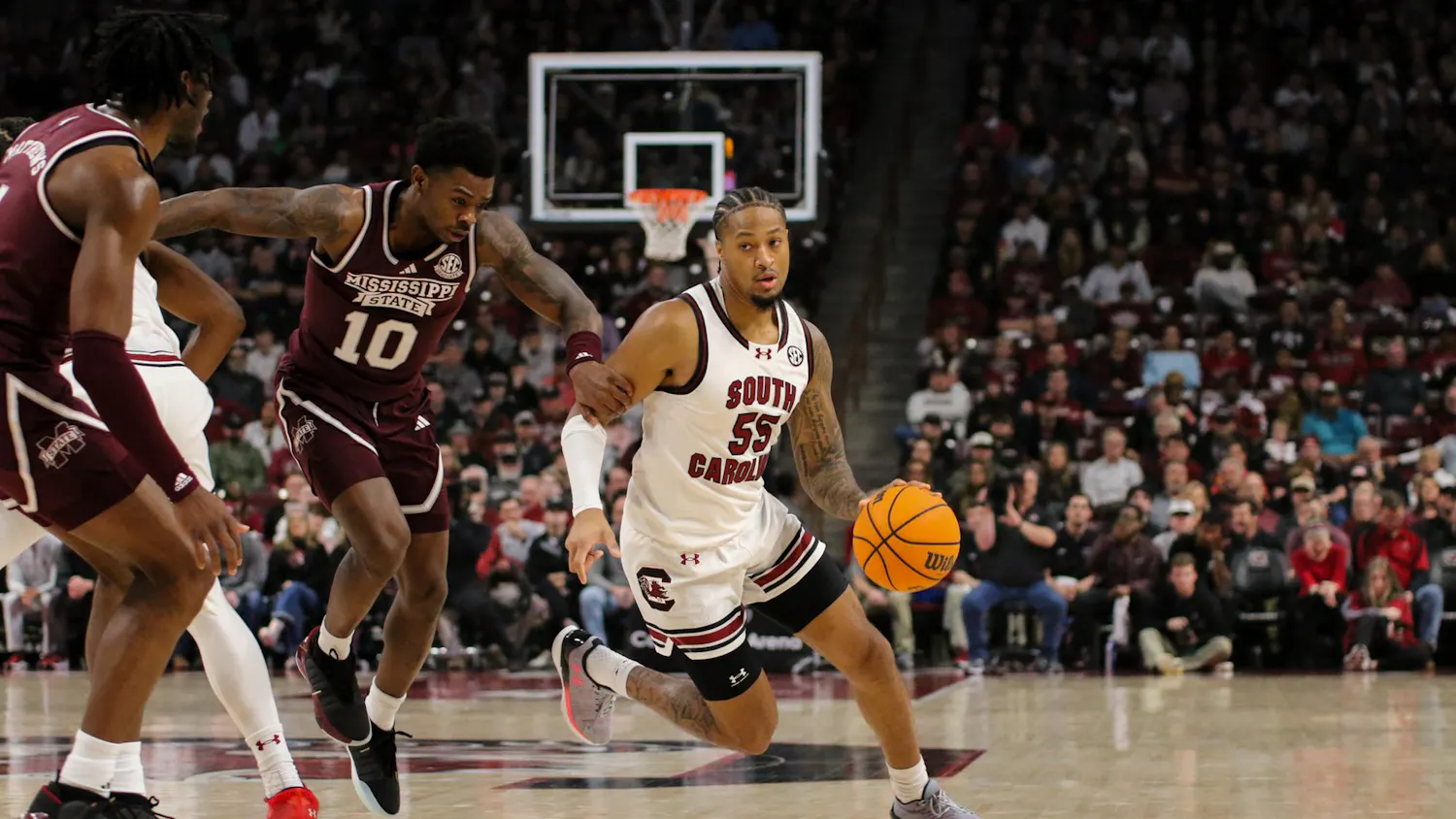 FILE - Graduate student guard Ta’Lon Cooper drives the ball past a defender at Colonial Life Arena on Jan. 6, 2024. Cooper led the team with seven assists during the 68-62 win against Mississippi State.
