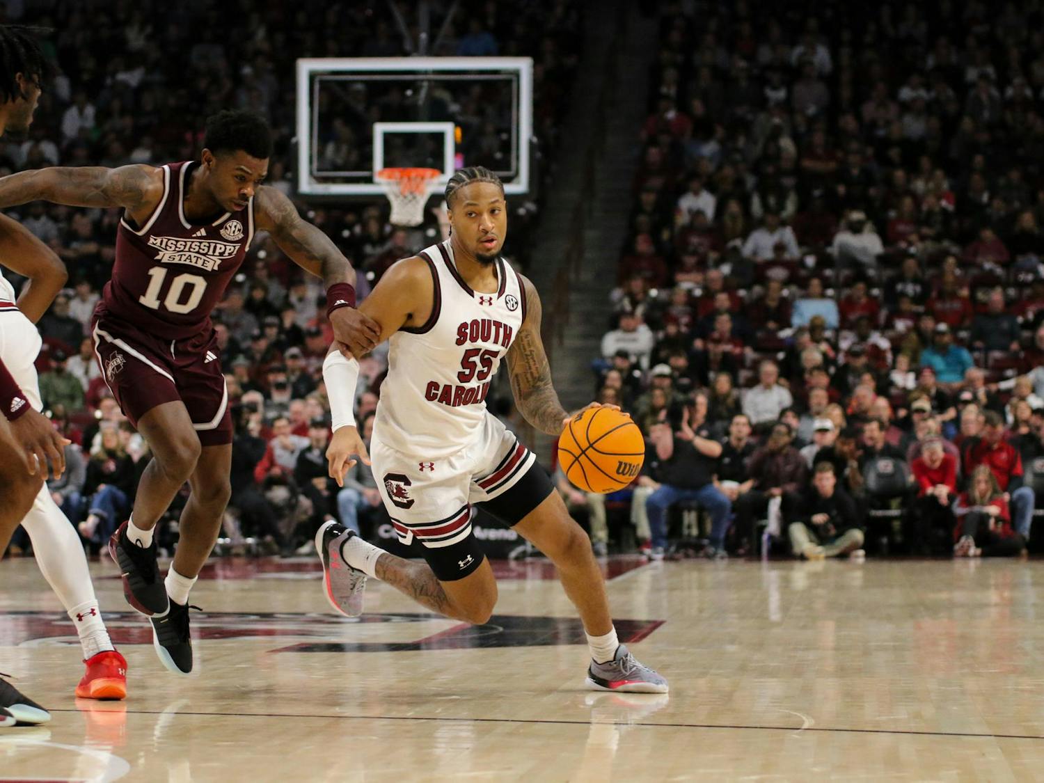 FILE - Graduate student guard Ta’Lon Cooper drives the ball past a defender at Colonial Life Arena on Jan. 6, 2024. Cooper led the team with seven assists during the 68-62 win against Mississippi State.